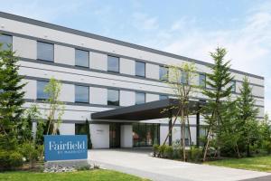 an office building with a sign in front of it at Fairfield by Marriott Hokkaido Minamifurano in Minamifurano