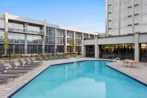 a swimming pool in front of a building at Delta Hotels by Marriott Somerset in Somerset