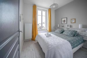 Posteľ alebo postele v izbe v ubytovaní Le George V - Appartement centre ville et parking