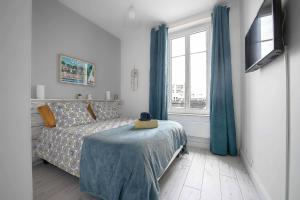 Posteľ alebo postele v izbe v ubytovaní Le George V - Appartement centre ville et parking