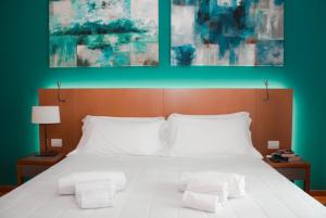Giường trong phòng chung tại Principe Alogna Hotel & SPA +37 ảnh