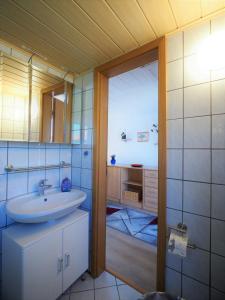 a bathroom with a sink and a mirror at Schüler, Wolfgang in Zingst