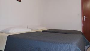 Postel nebo postele na pokoji v ubytování Nar Apartment