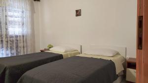 Postel nebo postele na pokoji v ubytování Nar Apartment