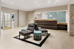 a lobby with two chairs and a waiting room at Residence Inn Saddle River in Saddle River