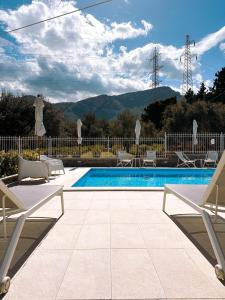 a swimming pool with a view of the mountains at Principe Alogna Hotel & SPA in Altavilla Milicia