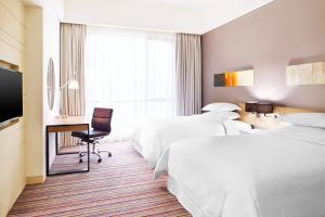 Ένα ή περισσότερα κρεβάτια σε δωμάτιο στο Four Points by Sheraton Puchong