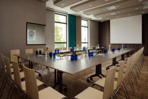 a large conference room with a long table and chairs at Courtyard by Marriott Sarajevo in Sarajevo