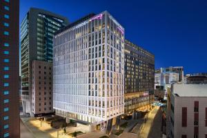 a rendering of a tall building in a city at Le Méridien Seoul Myeongdong in Seoul