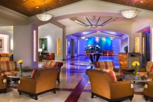 a lobby of a hotel with chairs and tables at San Diego Marriott Gaslamp Quarter in San Diego