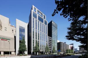 a rendering of a tall building in a city at AC Hotel by Marriott Tokyo Ginza in Tokyo