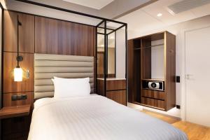Postel nebo postele na pokoji v ubytování AC Hotel by Marriott Stockholm Ulriksdal