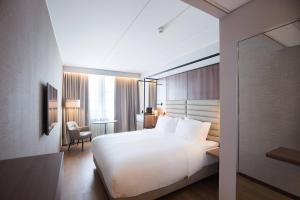Postel nebo postele na pokoji v ubytování AC Hotel by Marriott Stockholm Ulriksdal