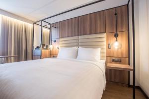 Postel nebo postele na pokoji v ubytování AC Hotel by Marriott Stockholm Ulriksdal
