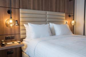 Postel nebo postele na pokoji v ubytování AC Hotel by Marriott Stockholm Ulriksdal