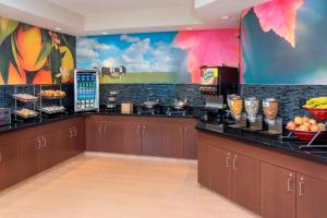 a restaurant with a buffet line with food on display at Fairfield Inn & Suites Temple Belton in Temple