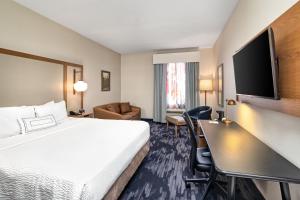 a hotel room with a bed and a desk at Fairfield Inn by Marriott Toronto Oakville in Oakville