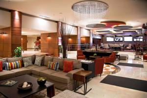 a lobby with a couch and a pool table at Marriott Tijuana Hotel in Tijuana