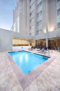 a swimming pool in the middle of a building at Courtyard by Marriott Saltillo in Saltillo