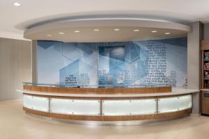 a lobby with a large wall with words on it at SpringHill Suites by Marriott Lafayette South at River Ranch in Lafayette