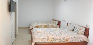 Postel nebo postele na pokoji v ubytování Trăng Non House
