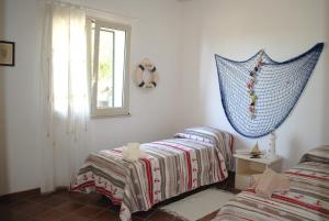 A bed or beds in a room at Le Case di Giulia