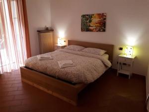 Giường trong phòng chung tại Appartamento La Meridiana a Traffiume