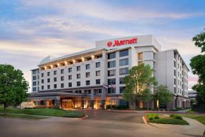 a hotel building with a martini sign on it at Denver Airport Marriott at Gateway Park in Aurora