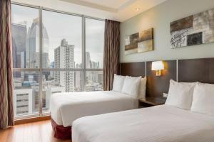 Rúm í herbergi á Marriott Executive Apartments Panama City, Finisterre