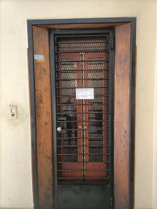 a black door with a gate in front of a building at Al Teatro in Verona