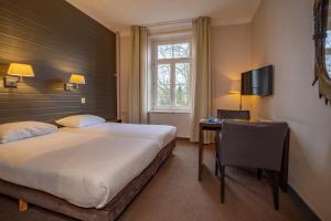 Llit o llits en una habitació de Fletcher Hotel Restaurant De Geulvallei