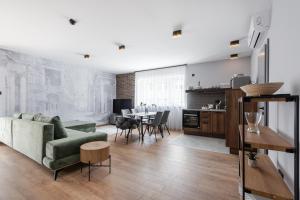a living room with a couch and a table at Radnoti Home in Veszprém