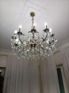 a chandelier hanging from a ceiling in a room at Al Teatro in Verona