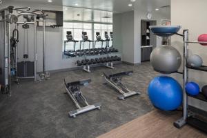 a fitness room with a bunch of weights and exercise equipment at Fairfield Inn & Suites by Marriott Oklahoma City Downtown in Oklahoma City