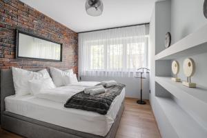 Postel nebo postele na pokoji v ubytování Radnoti Home