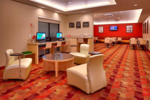 a lobby with a waiting room with computers and chairs at TownePlace Suites by Marriott Vernal in Vernal