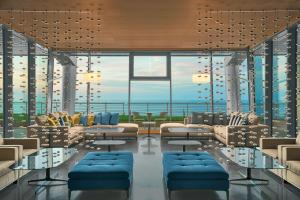 a living room with a view of the ocean at Four Points by Sheraton Oran in Oran