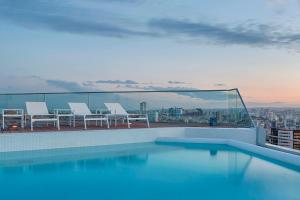 a swimming pool on the roof of a building at Four Points by Sheraton Oran in Oran