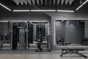 a gym with exercise equipment in a room at Courtyard by Marriott Calgary Downtown in Calgary