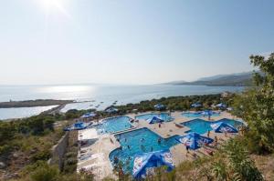 an aerial view of a swimming pool next to the water at Luxury Mobile Homes - Adria Superior in Klenovica