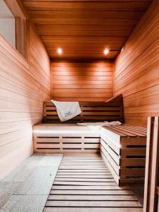 a sauna with two beds in a wooden room at Principe Alogna Hotel & SPA in Altavilla Milicia