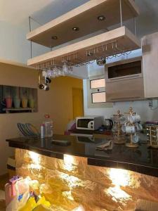 a kitchen with a counter top in a room at Chalet in Stella Marina, El Alamein in El Alamein