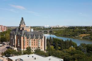an aerial view of a building next to a river at Delta Hotels by Marriott Saskatoon Downtown in Saskatoon
