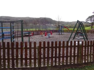 a group of children playing in a playground at Cottage 420 - Clifden in Clifden