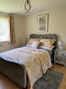 a bedroom with a large bed and a window at Modern Spacious Gated Two Bedrooms Apartment in Stifford