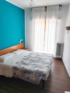 Postel nebo postele na pokoji v ubytování Hotel Luisa