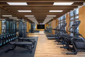 a gym with rows of treadmills and machines at Fairfield by Marriott Shanghai Hongqiao NECC in Shanghai