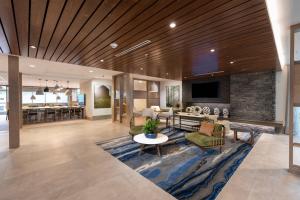 a lobby with a living room and dining room at Fairfield Inn & Suites Arkadelphia in Arkadelphia