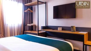 Postel nebo postele na pokoji v ubytování Urban Hotel & Spa