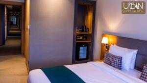 Postel nebo postele na pokoji v ubytování Urban Hotel & Spa
